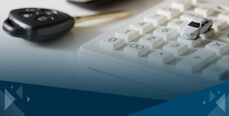 Business auto expense concept showing toy car and calculator on desk